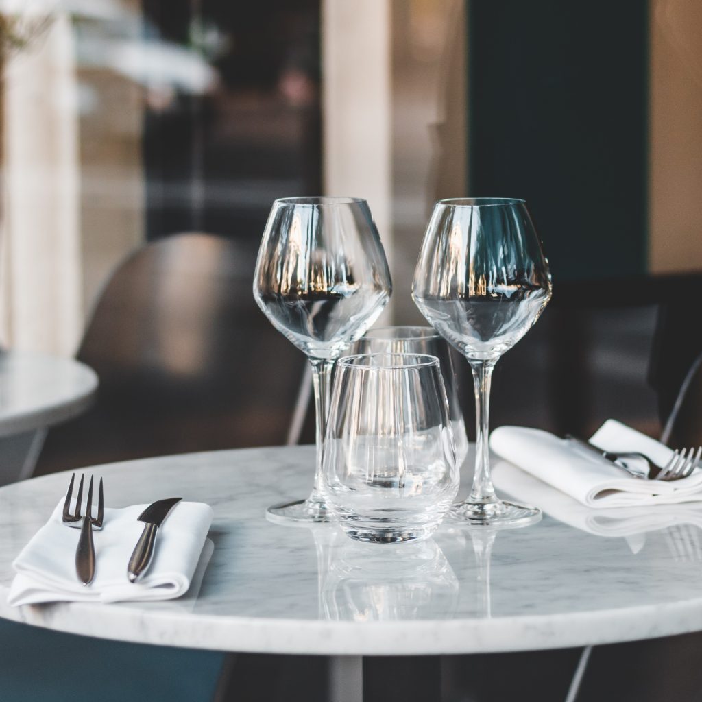 Empty wine glasses on a cafe table in Paris